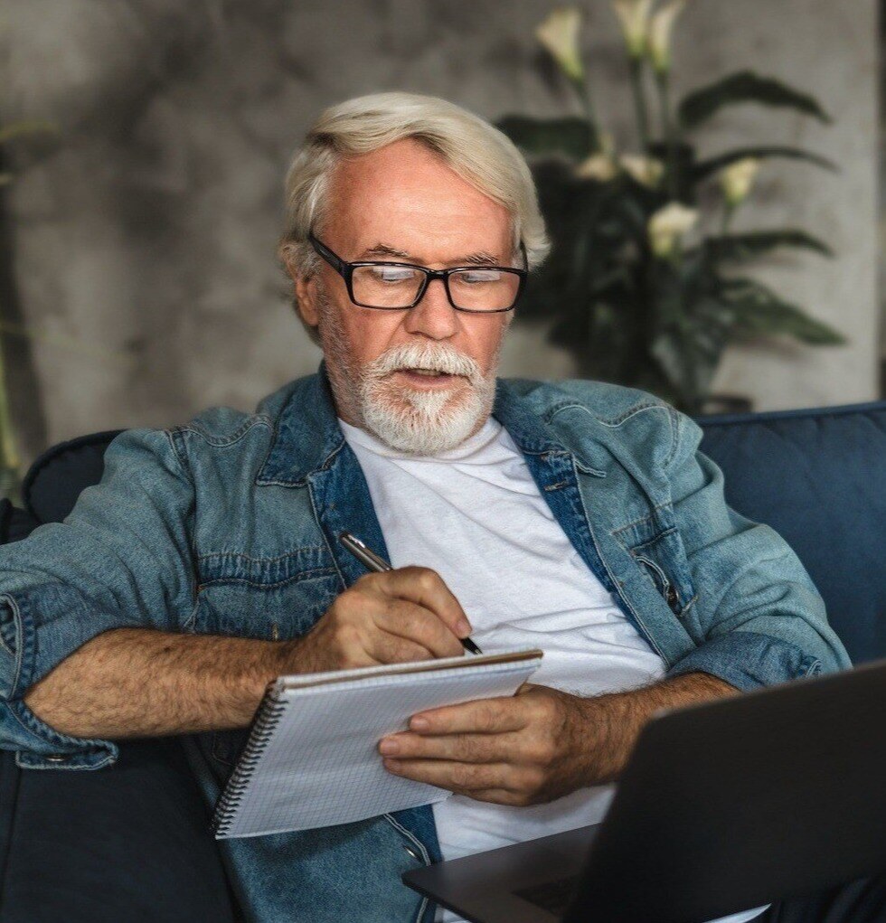 Man Studying Webinar on Sofa Small-1-1-1